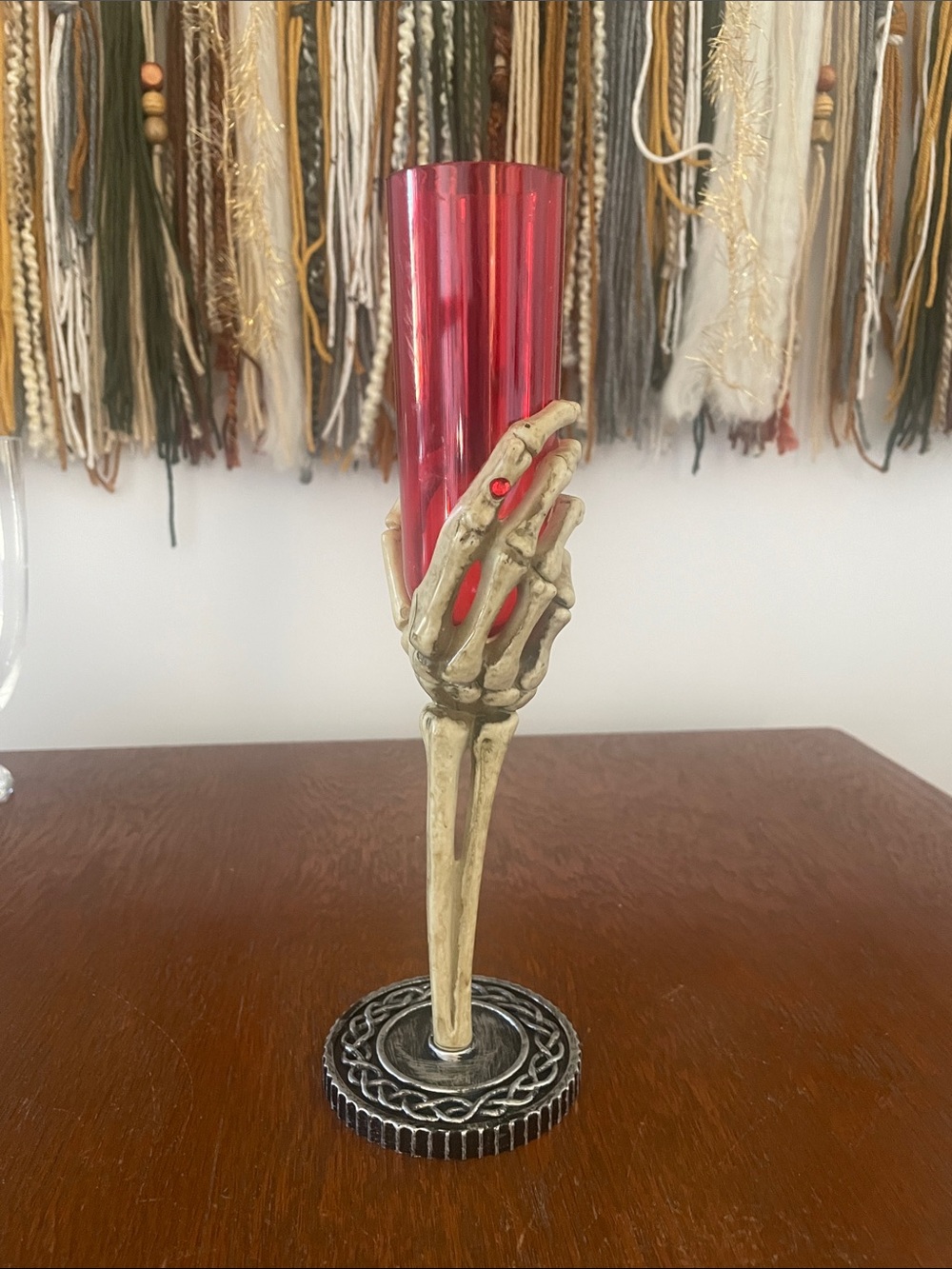 Skeleton Hand holding a Red Glass Halloween decor